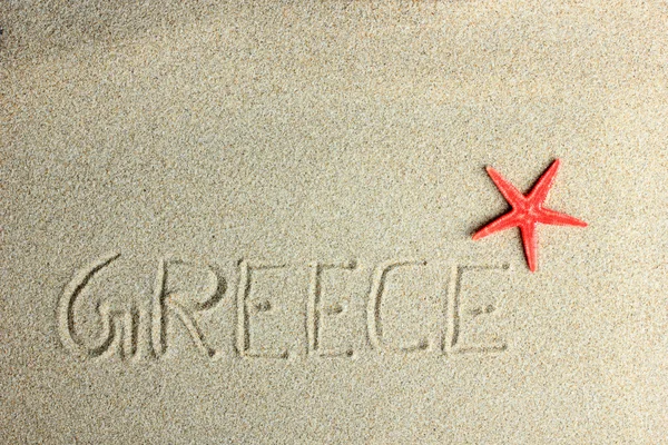 Red starfish in the sand — Stock Photo, Image