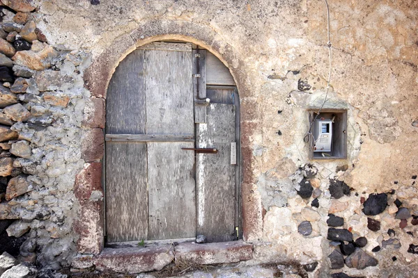 A very worn and battered old blue door — Stock Photo, Image