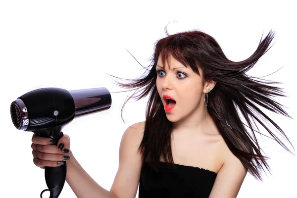 Mujer con peinado de moda sosteniendo secador de pelo —  Fotos de Stock