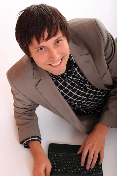 stock image Young business man standing with laptop