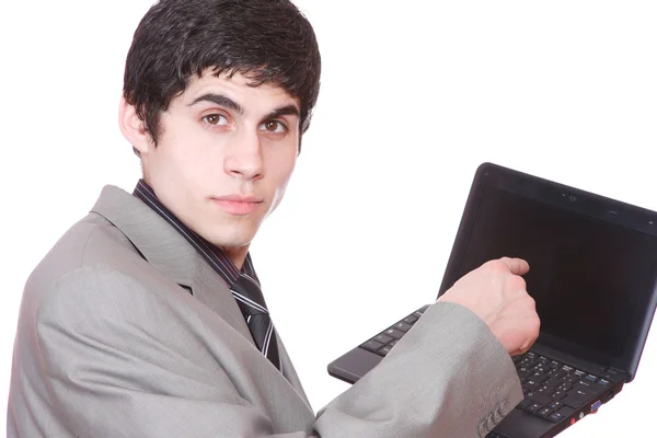 Homem de negócios exibindo um laptop — Fotografia de Stock