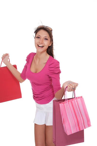 Mujer feliz con bolsas de compras rosas — Foto de Stock