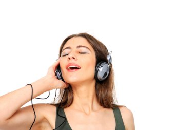 Cool teenager listening to music and dancing