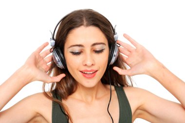 Cool teenager listening to music and dancing