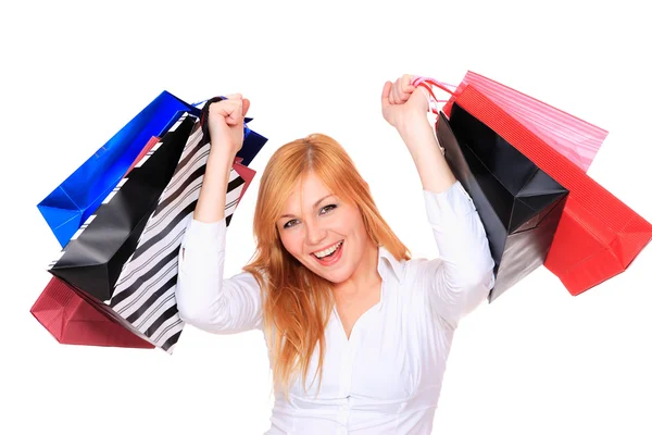 Młoda kobieta z dużą ilością toreb na zakupy — Zdjęcie stockowe