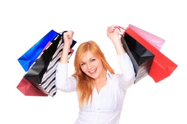 Mladá žena se spoustou nákupních tašek — Stock fotografie