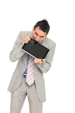 Young business man standing using a tablet