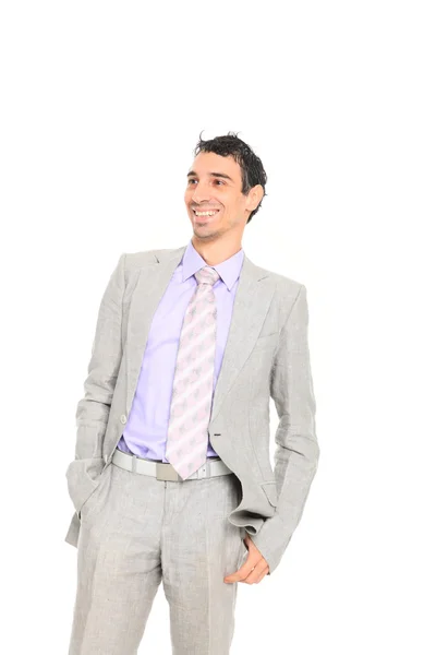 Young business man standing with hands in pocket — Stok fotoğraf