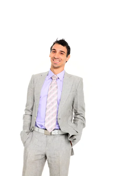 Young business man standing with hands in pocket — Stockfoto