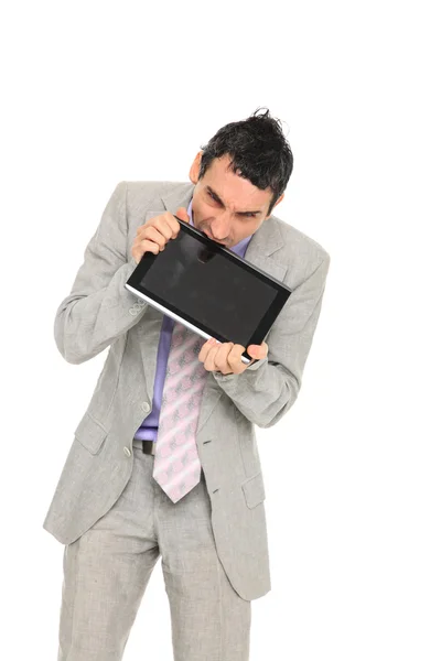 Young business man standing using a tablet — Stock Photo, Image