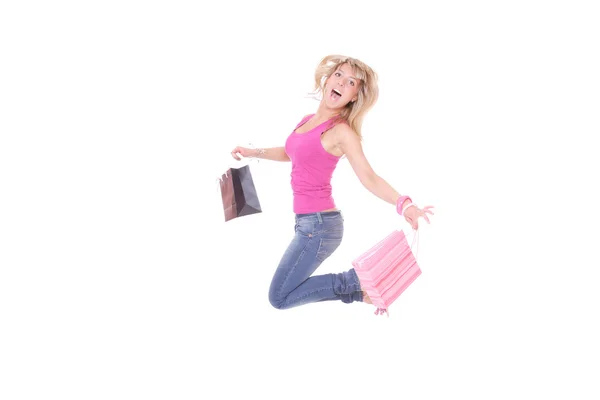 Vrouw springen met shopping tassen — Stockfoto