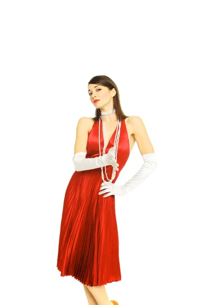 Jonge vrouw in de rode jurk en witte handschoenen — Stockfoto