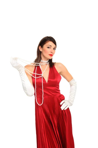 Młoda kobieta w czerwonej sukience i białe rękawiczki — Zdjęcie stockowe