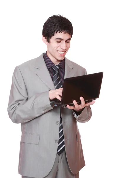 Un atractivo hombre de negocios usando su portátil — Foto de Stock
