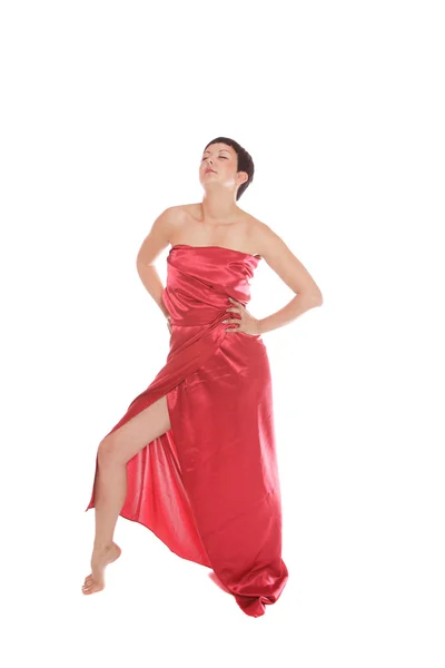 Belle jeune femme en robe longue rouge — Photo