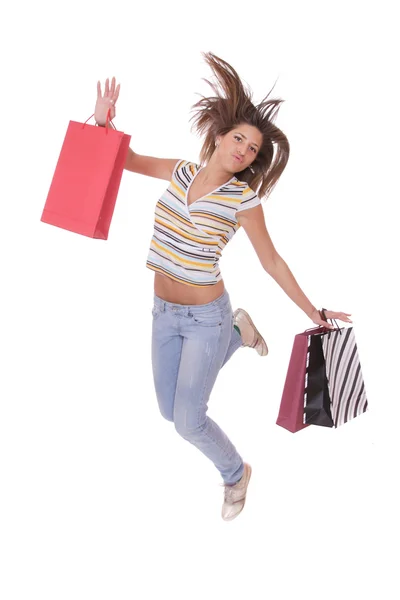 Žena skákání s nákupní tašky — Stock fotografie