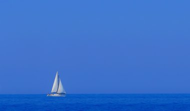 Boat in deep blue water clipart