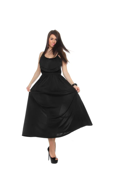 Volledige lengte vrij sexy meisje poseren in een mooie zwarte jurk — Stockfoto