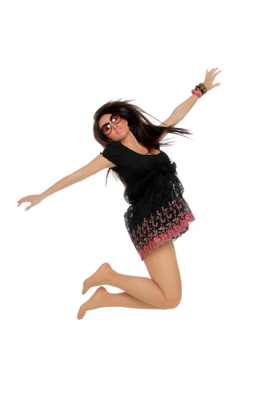 Porträtt av en ganska ung kvinna hoppa i glädje — Stockfoto