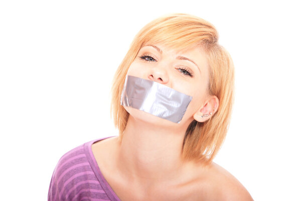 Beautiful woman with tape on mouth