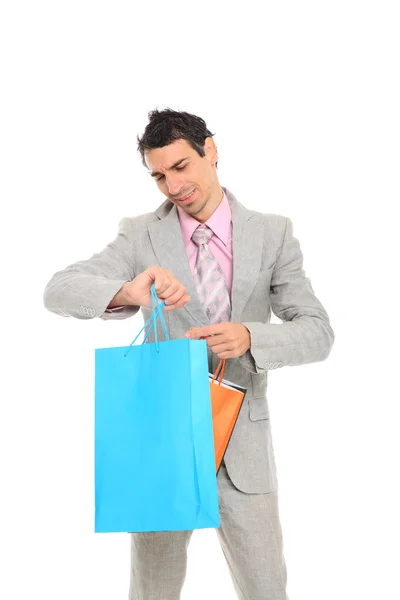 Hombre joven con bolsas de compras —  Fotos de Stock