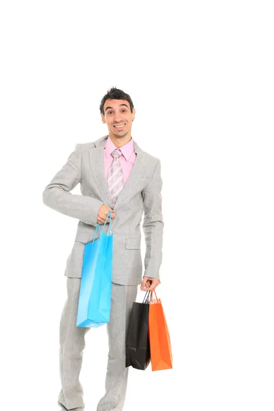 Młody człowiek z torbami na zakupy — Zdjęcie stockowe