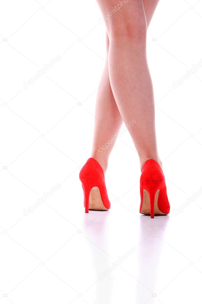 Beautiful legs in red shoes