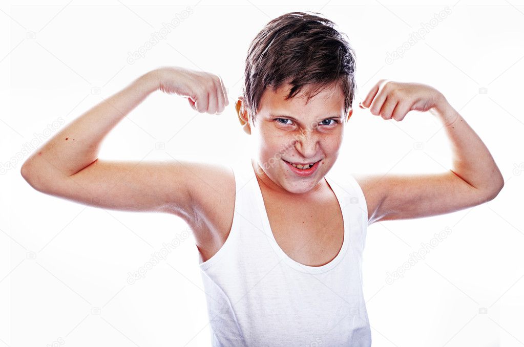 Young boy flexing biceps