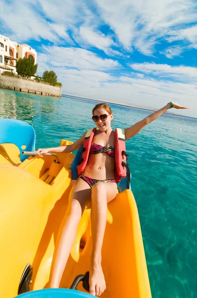 Cheerful young woman riding catamaran — Stock Photo, Image