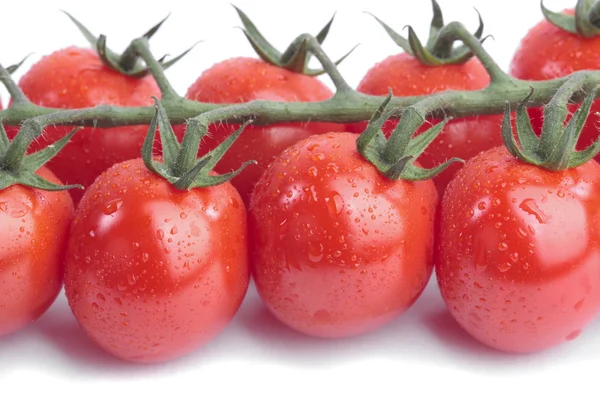 Rajčata Cherry révy nad bílým pozadím — Stock fotografie