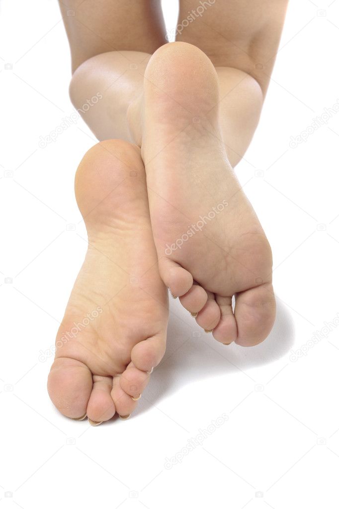 Woman legs massaging feet isolated over white background