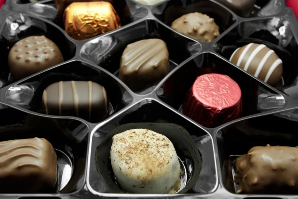 stock image Box of assorted chocolates over white background