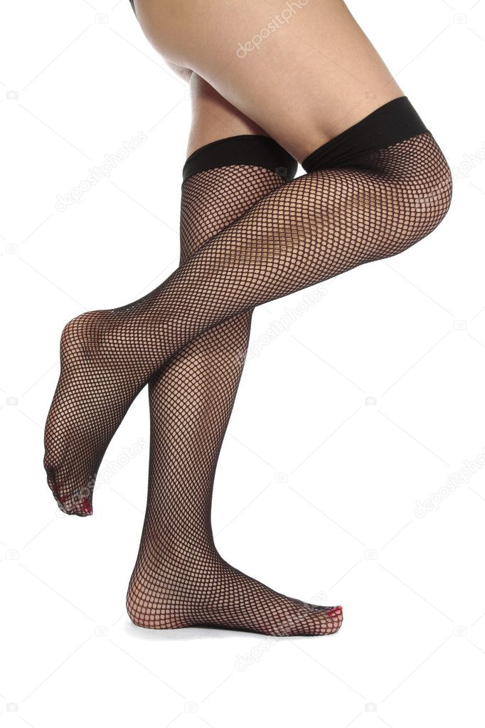 feet and legs in black fishnet tights