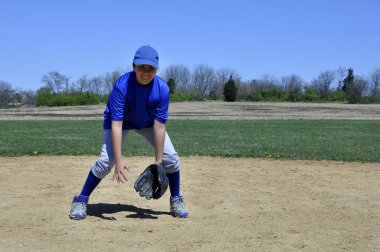 Young infield baseball player clipart