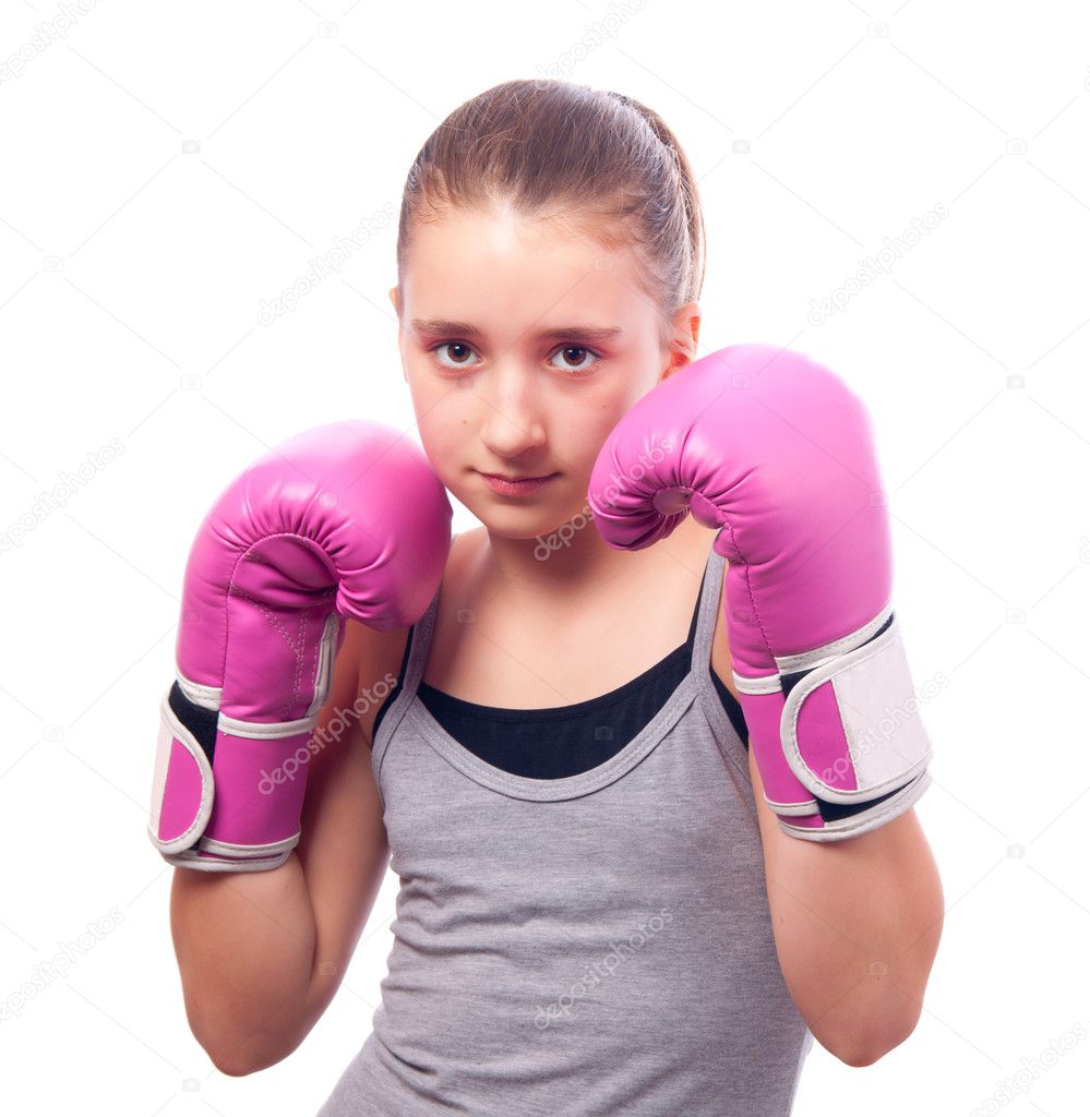Portrait of pretty kick boxing girl with pink gloves