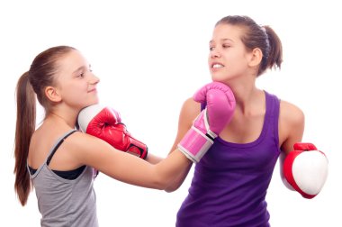 Pretty kick boxing teenage girls fighting isolated on white background clipart