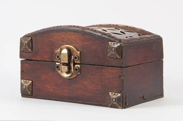 Wooden chest with metal lock and some carvings — Stock Photo, Image