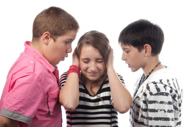 Two angry teenage boys harassing frightened girl clipart