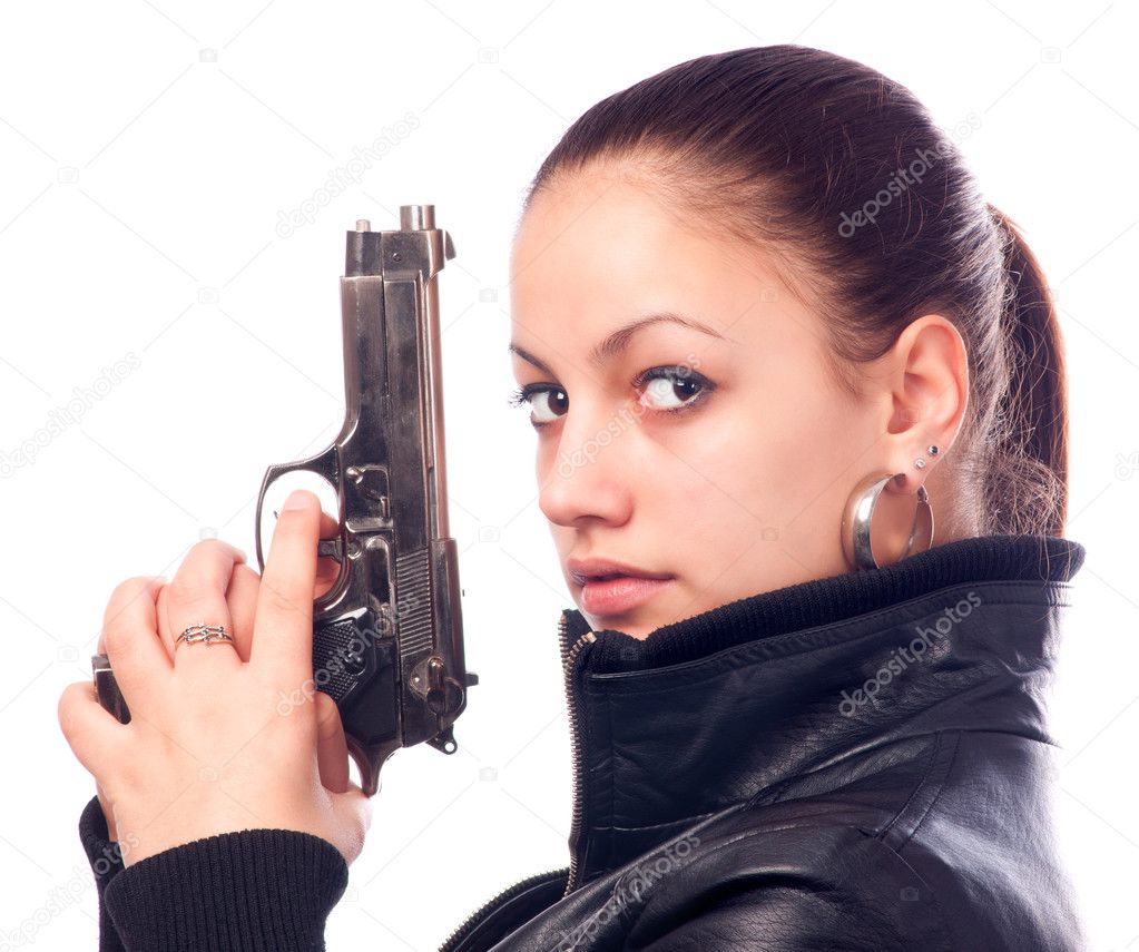 Beautiful girl in black leather jacket and beretta gun in her hands