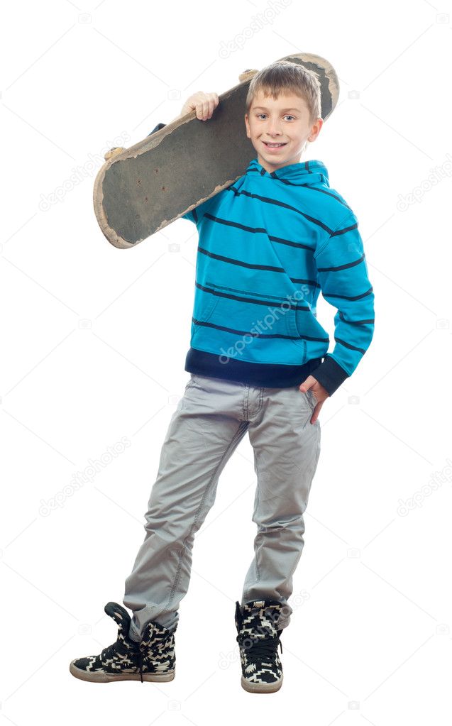 Cute teenage boy posing with skateboard in his hand isolated on white