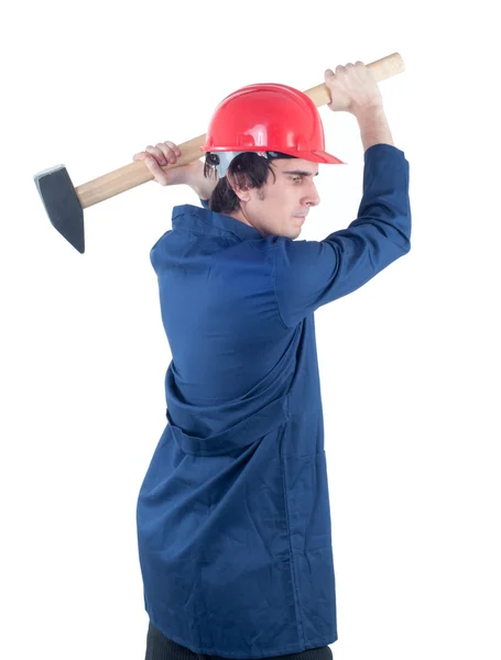 Trabalhador batendo com martelo pesado isolado em branco — Fotografia de Stock