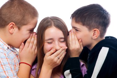 Two teenage boys telling jokes to teenage girl clipart