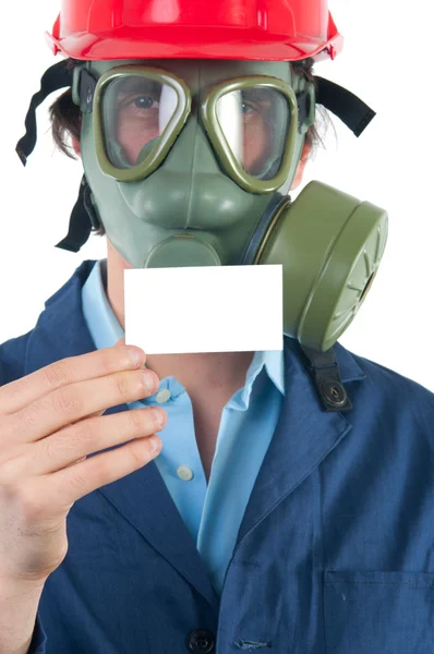Professionell med gasmask och hjälm håller visitkort med plats för — Stockfoto