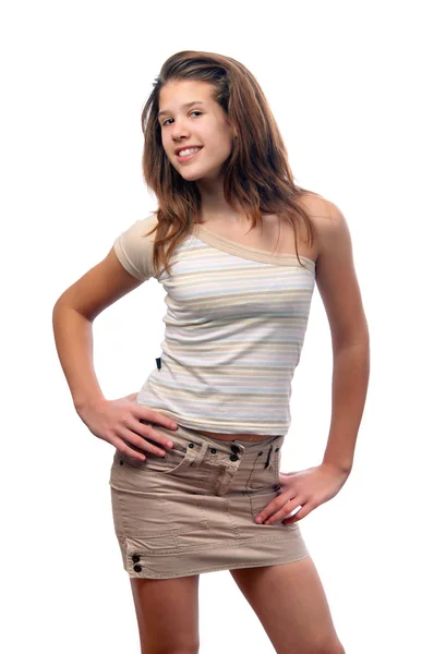 Sevimli genç kız kısa kahverengi etek ve bluz üzerine beyaz izole gülümseyen — Stok fotoğraf