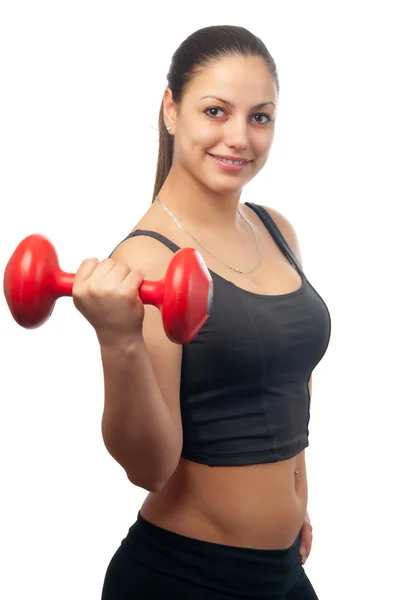 Mujer atractiva joven haciendo ejercicio con mancuerna roja aislada en blanco — Foto de Stock