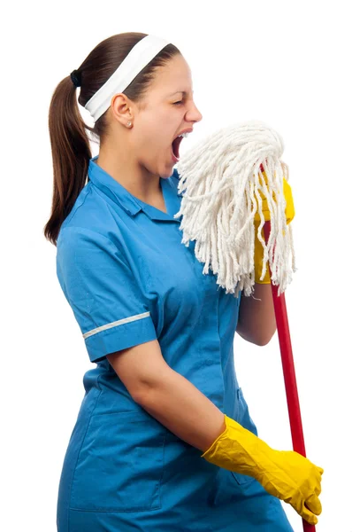 Beautiful young cleaning lady pretending to be a singer isolated on whiteBeautiful young cleaning lady pretending to be a singer isolated on white — Stockfoto