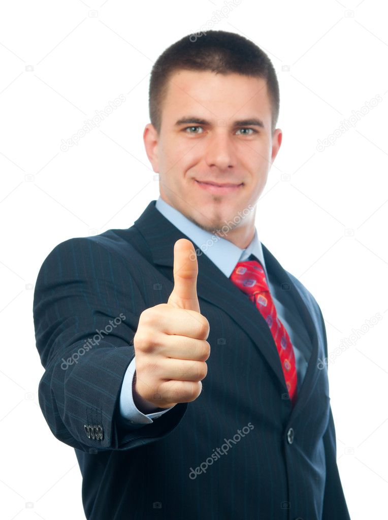 Handsome smiling businessman showing thumbs up isolated on white