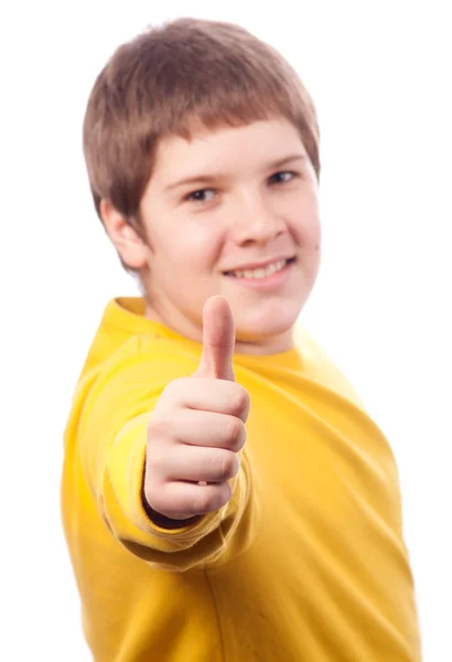 Красивий пухкий хлопчик-підліток показує великі пальці вгору ізольовано на білому — стокове фото