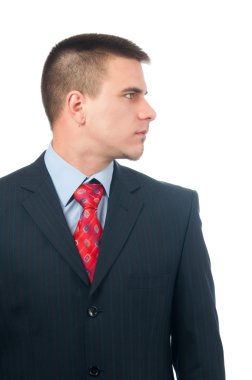 Serious attractive young businessman from profile clipart