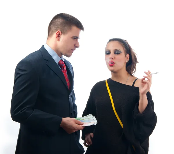 Young businessman giving money to the girl of questionable moral — Stock Photo, Image